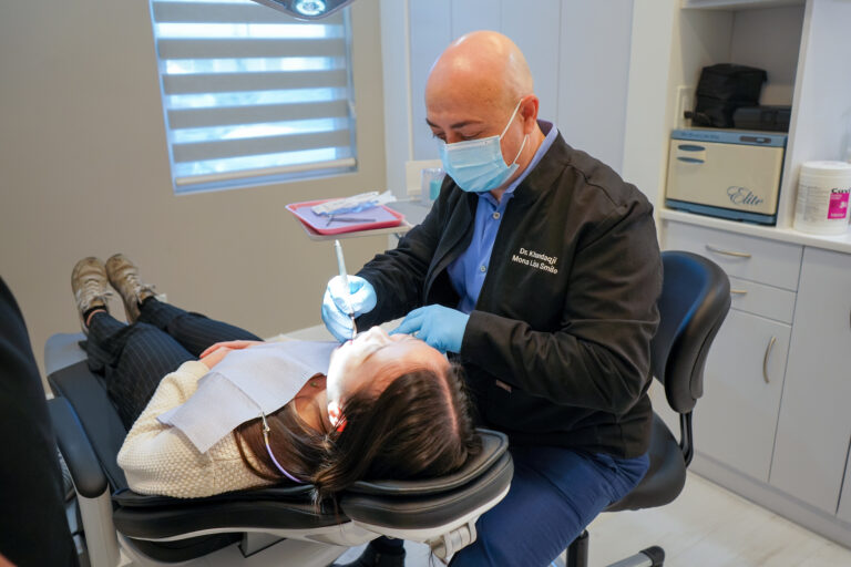 Dr. Mohammad Khandaqji performing preventive dentistry treatment on a patient at Mona Lisa Smile Dental, focusing on gentle, proactive oral care.